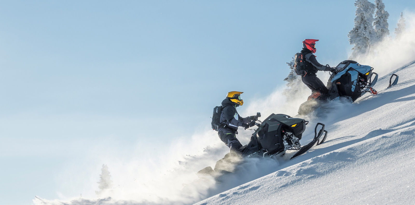 Two ski-doo riders in deep snow
