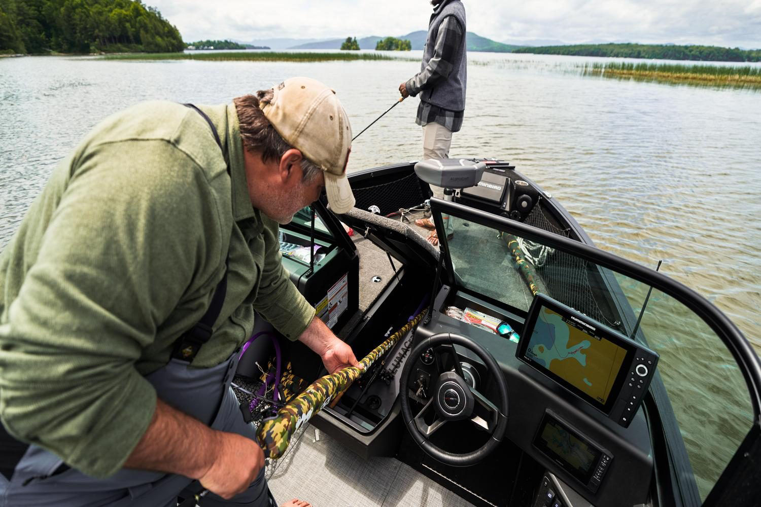 A fisherman enjoying the intelligent storage space of Alumacraft boats