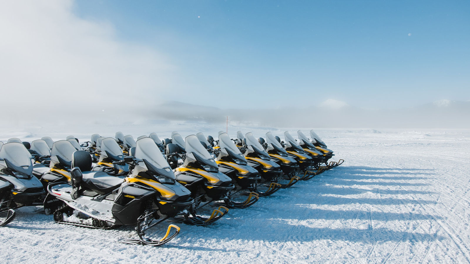 Rows of Ski-Doo Grand Touring Electric snowmobile