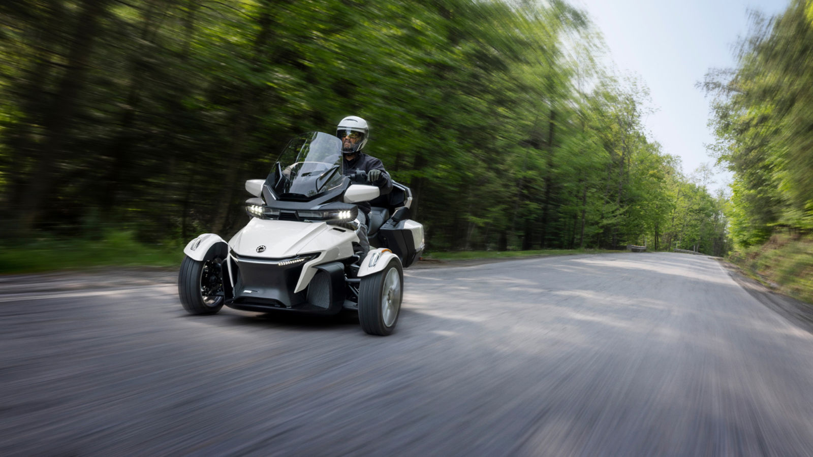 Can-Am 3-wheel line up on a sandy area