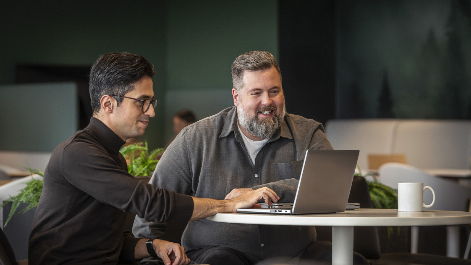 BRP employees brainstorming around a table