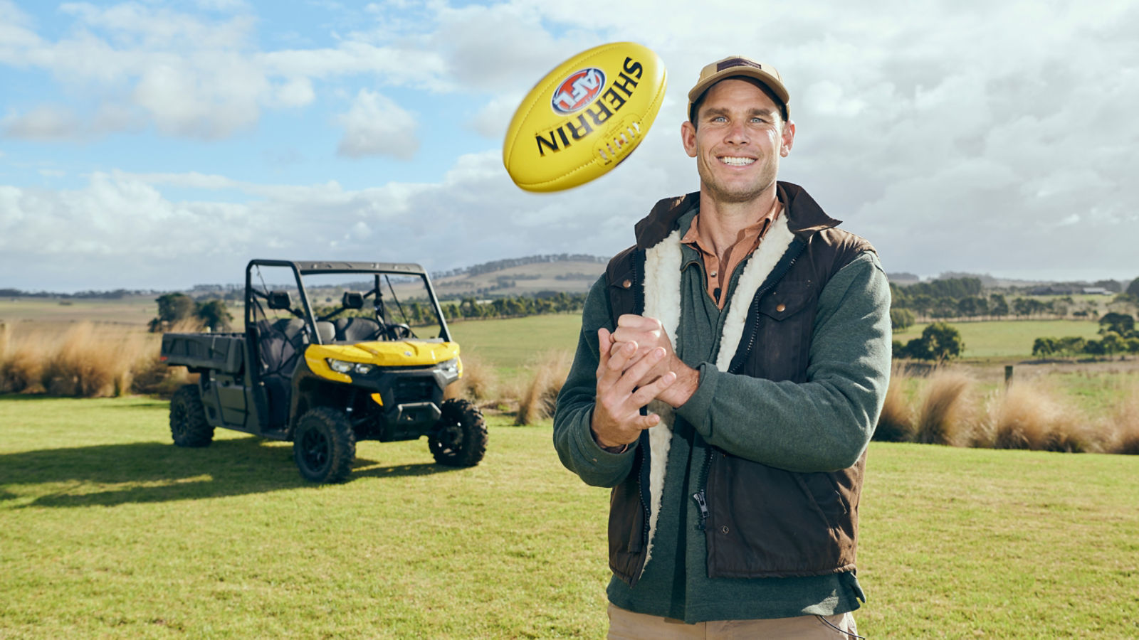 Tom Hawkins standing with his Can-Am Defender
