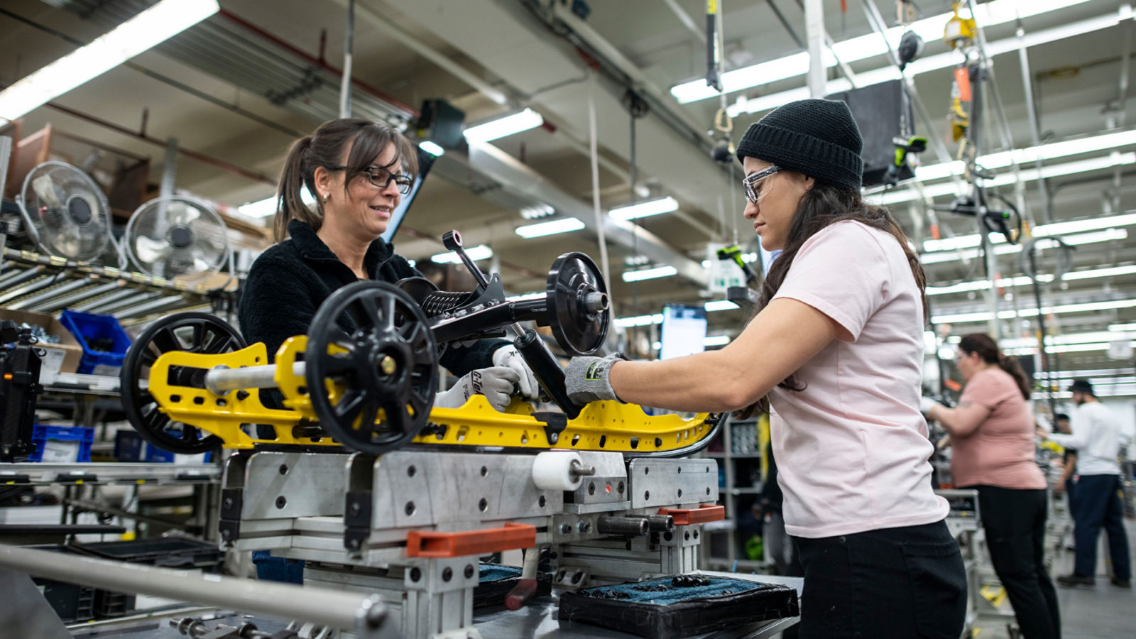 Workers in a BRP manufacturing facility