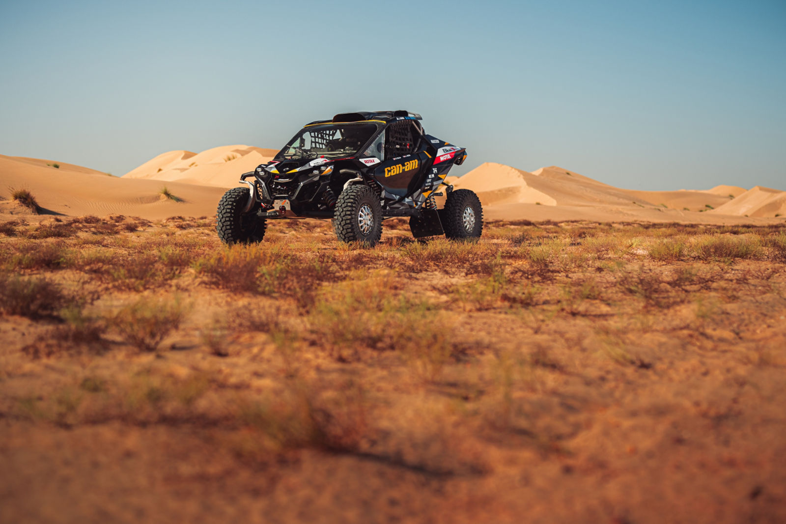 A Can-Am side-by-side in a sand dune 