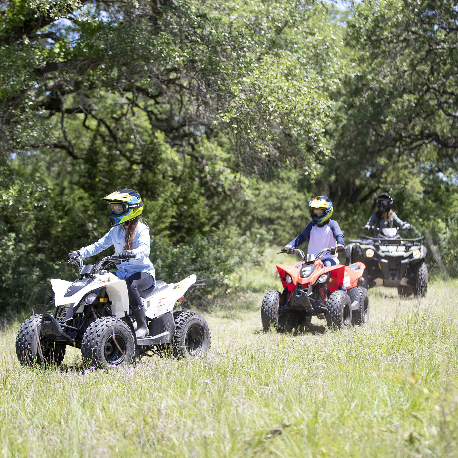 Kids riding on their Can-Am Off-Road DS ATVs