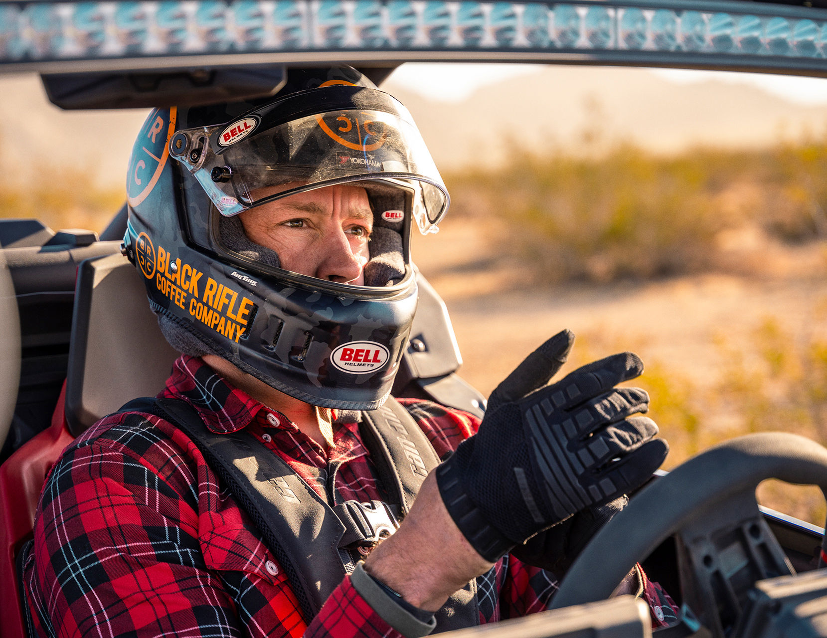A Can-Am ambassador at the wheel of a side-by-side vehicle