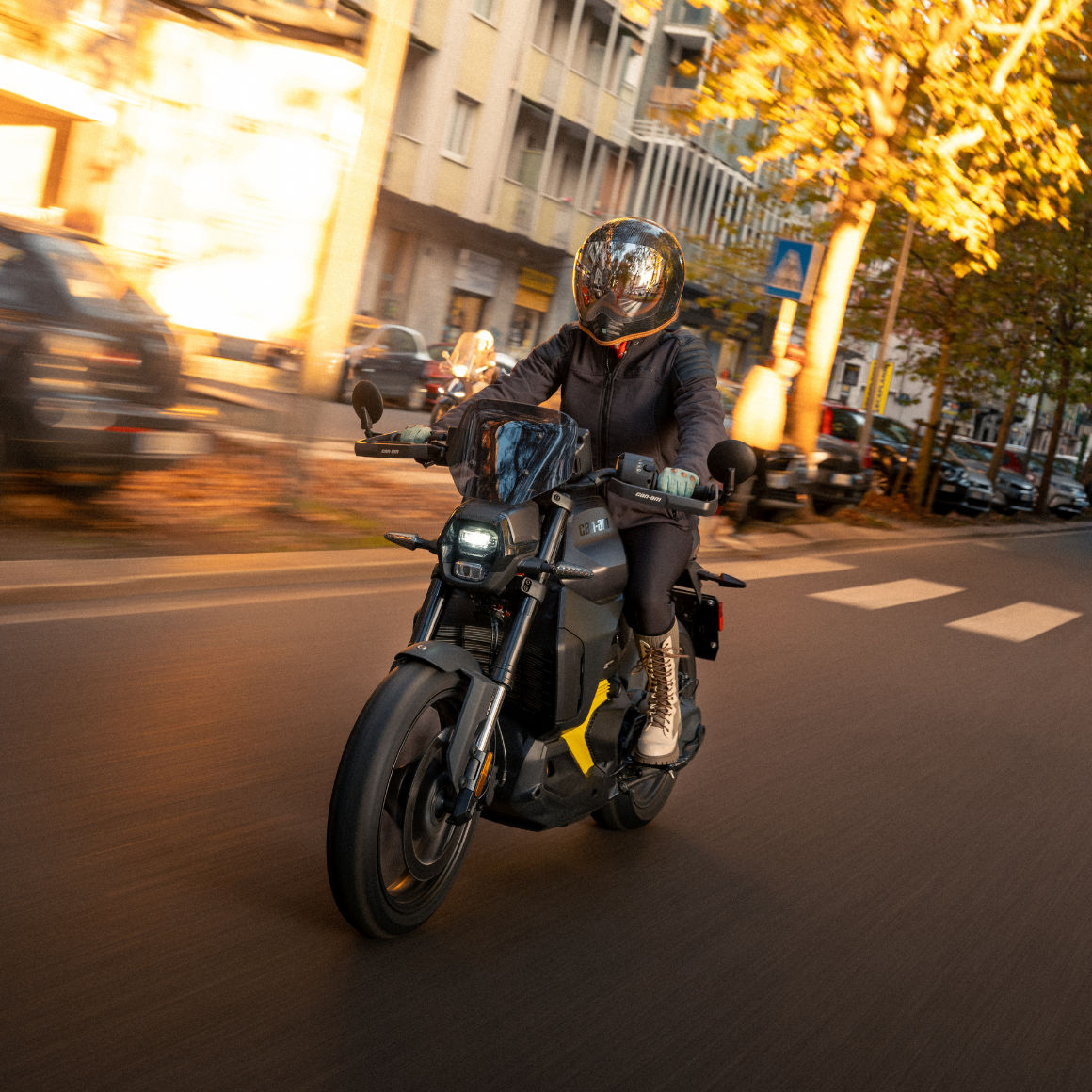 Motorcyclist riding a Can-Am electric motorcycle in the city