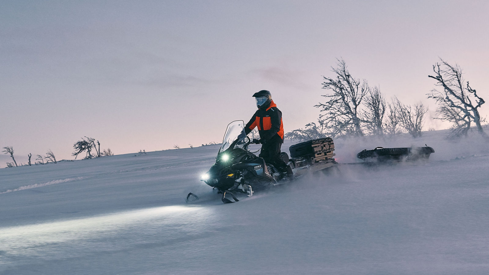 Lynx Commander riding on a snowy hill