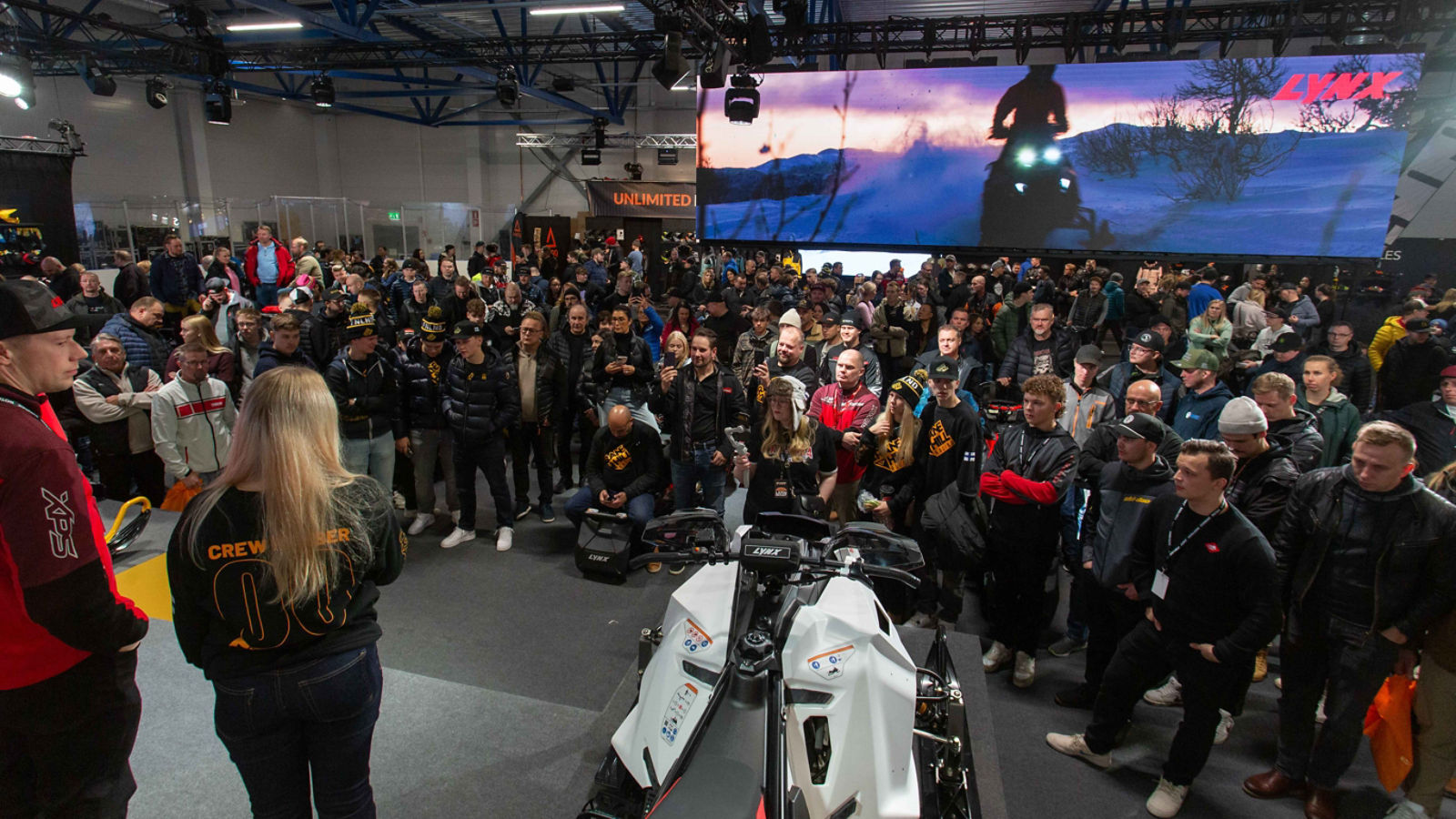 Audience gathered to watch an interview at the snowmobile fair
