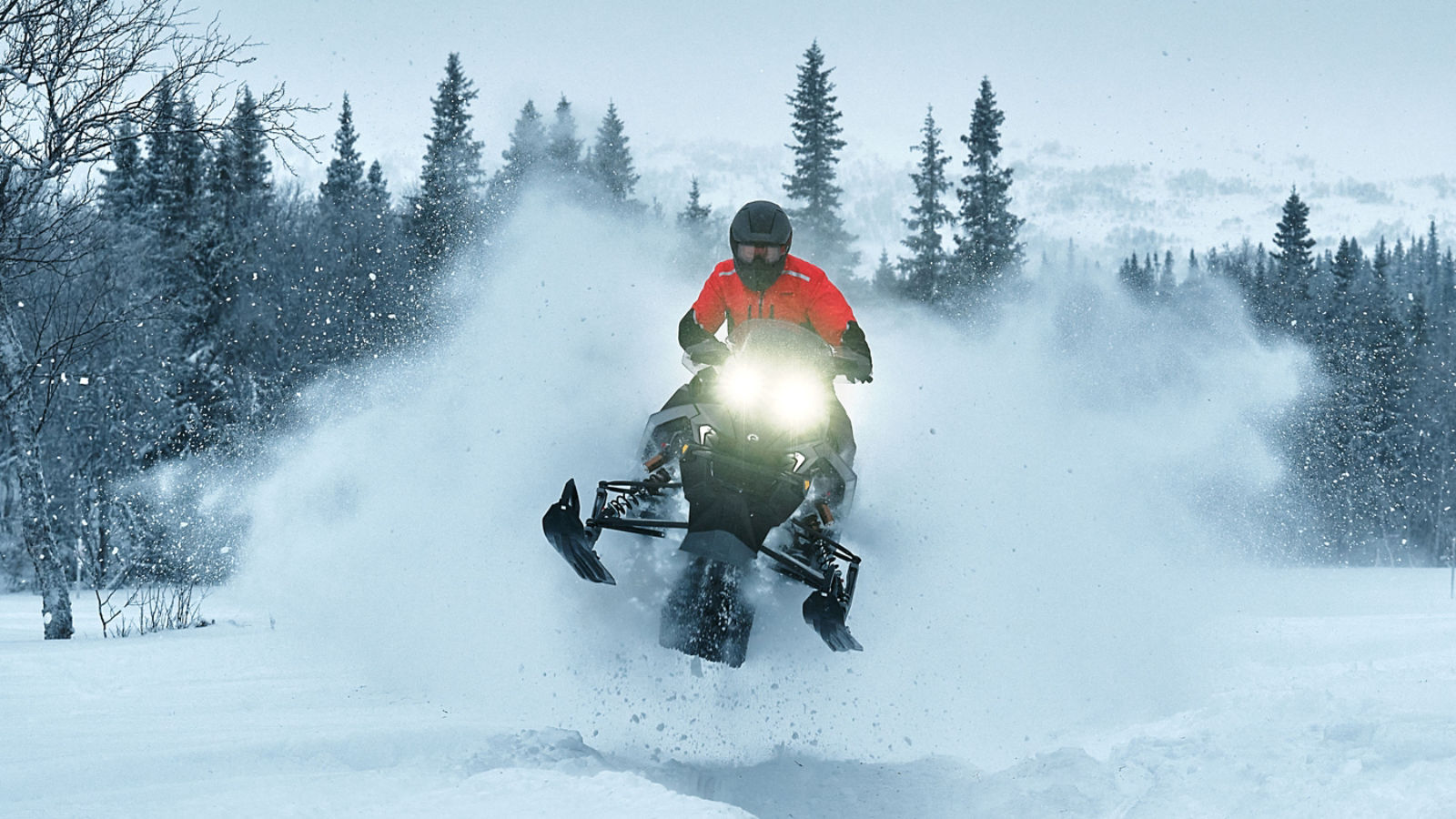 Lynx Rave RE 850 Turbo R 2026 snowmobile riding aggressively on bumpy trail