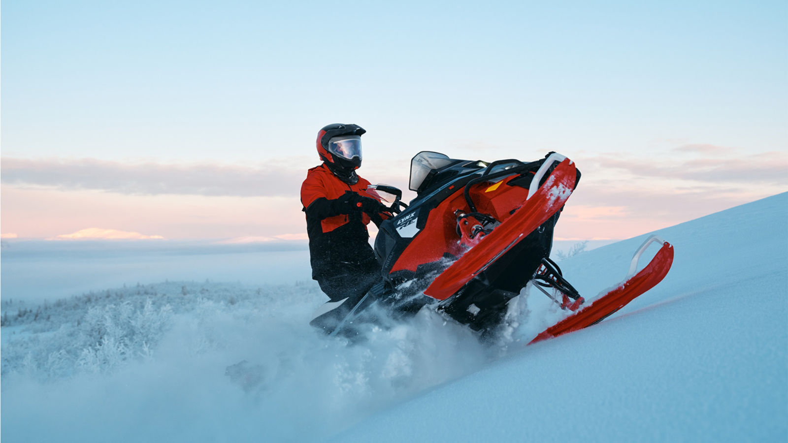 Rider riding up a snowy hill on a 2027 Lynx Brutal RE snowmobile