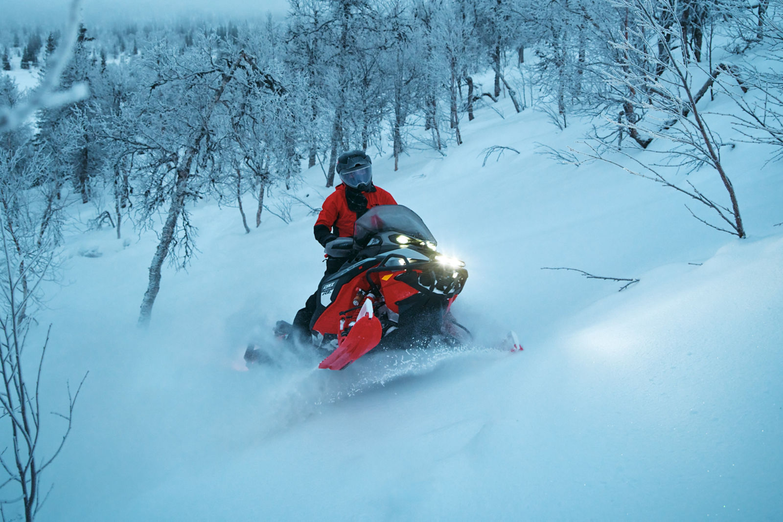 2027 Lynx Brutal RE riding up a snowy hill