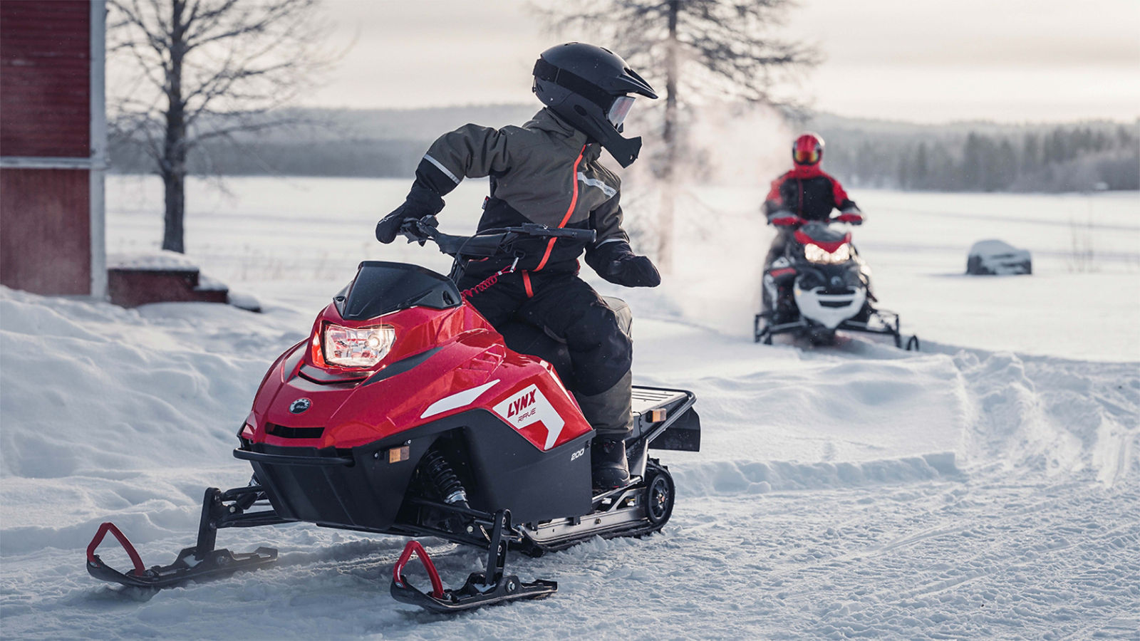 Lynx Rave snowmobile riding on trail