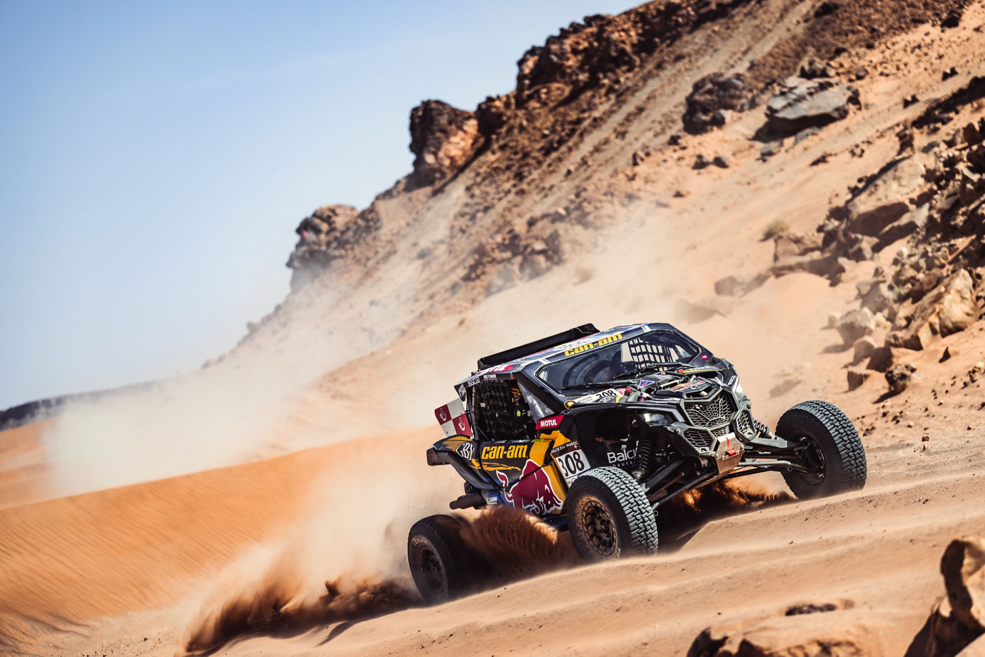 A Can-Am Maverick competing in the dunes