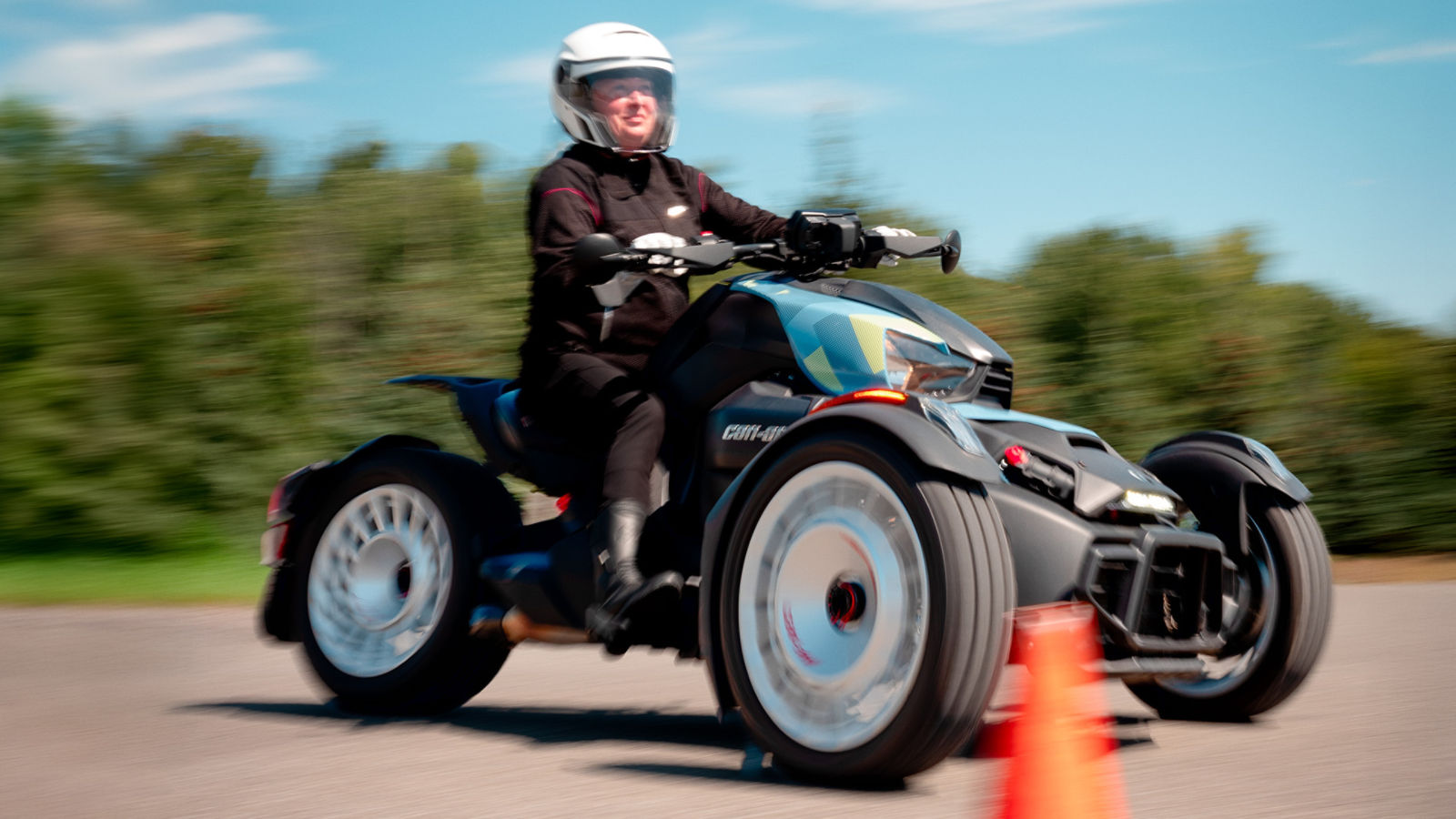 A woman taking her driving lesson aboard her Can-Am three-wheeler