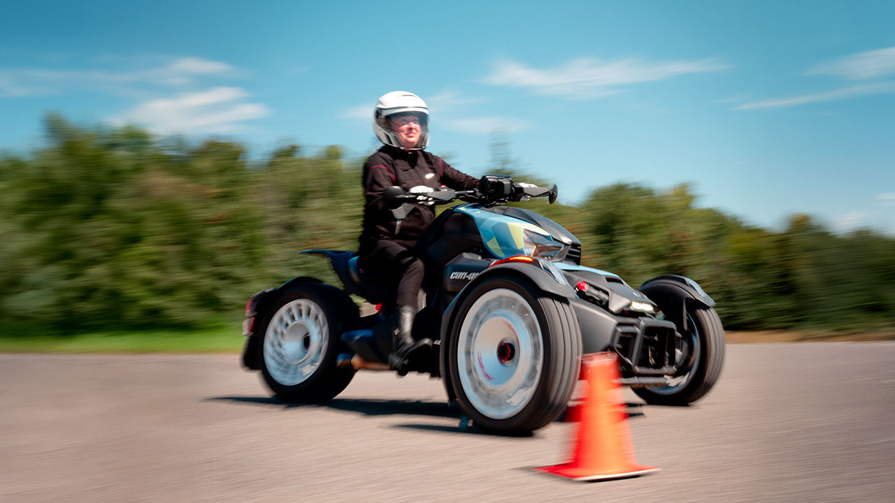 A woman taking her driving lesson aboard her Can-Am three-wheeler