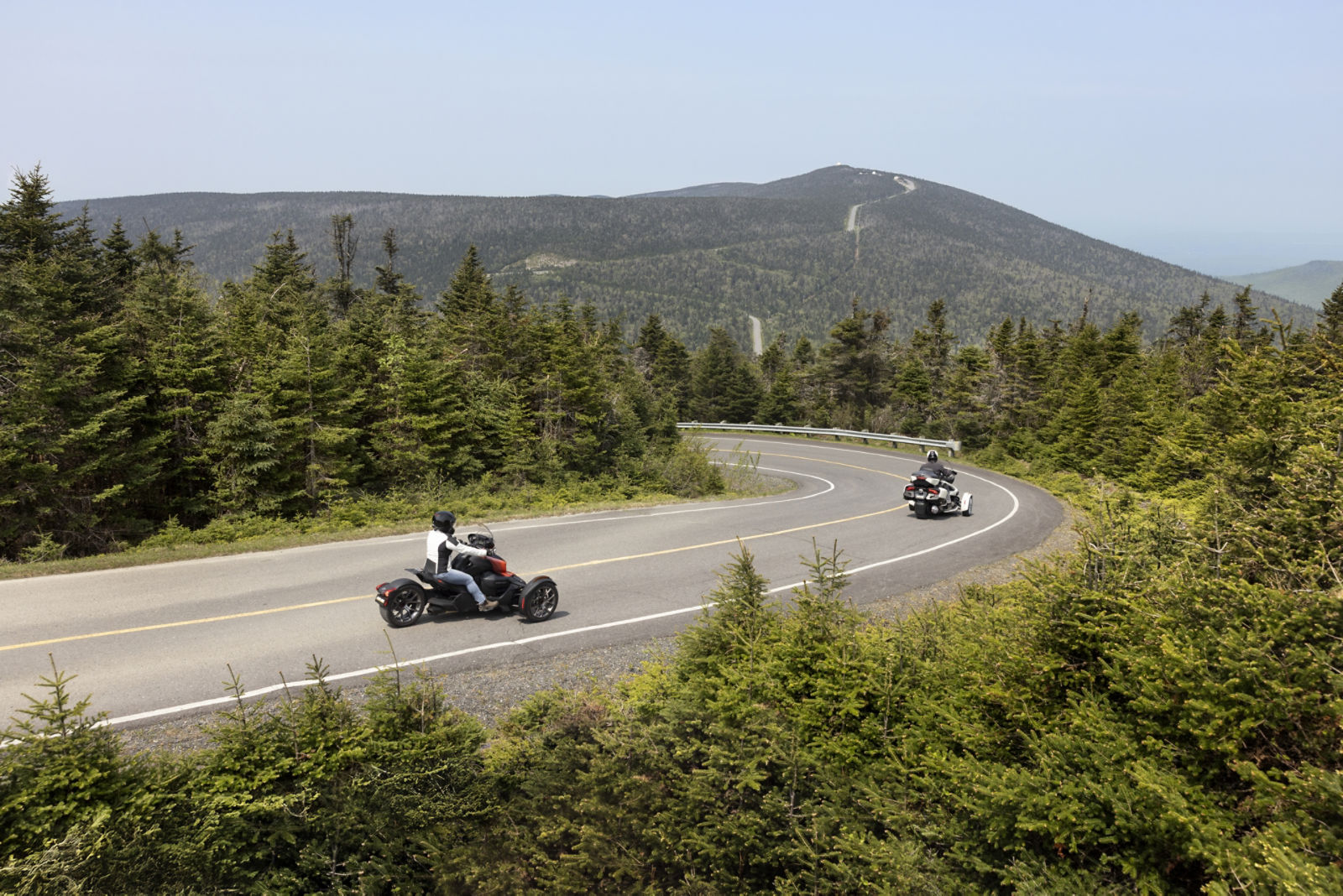 The 3 new Can-Am Canyon 3-wheel vehicles on a gravel road