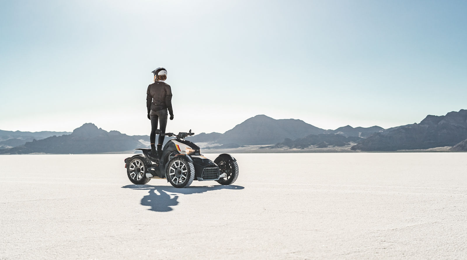 Rider standing on the seat of vehicle