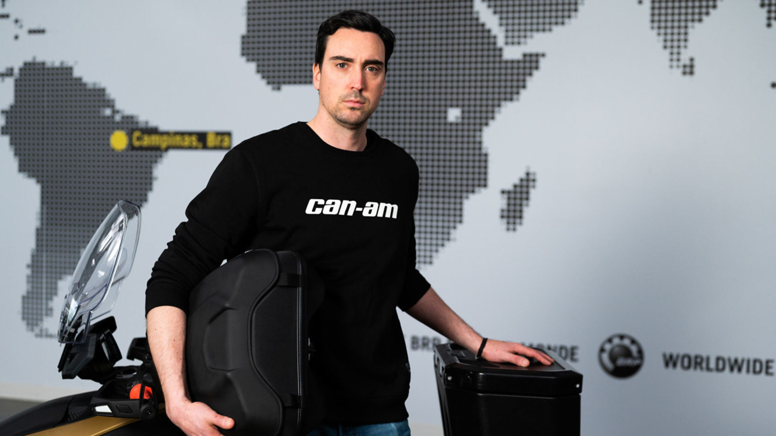 Men showing cargo options for a Can-Am Ryker