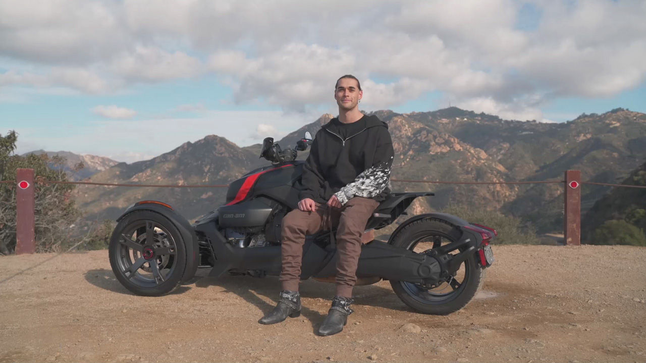 Josh Wright sitting leaning on his Ryker