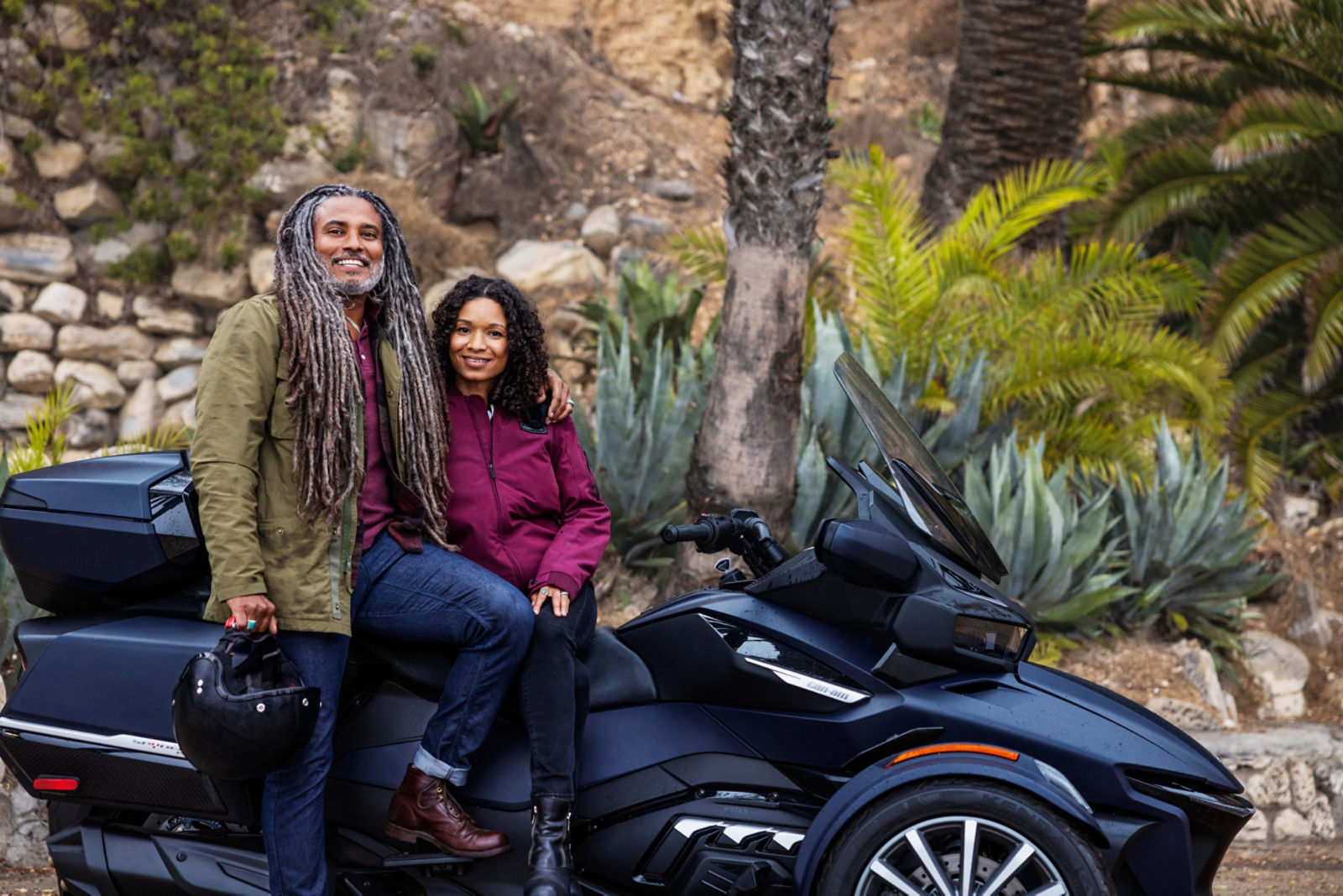 Couple sitting on a Can-Am Spyder RT 3-Wheel Vehicle