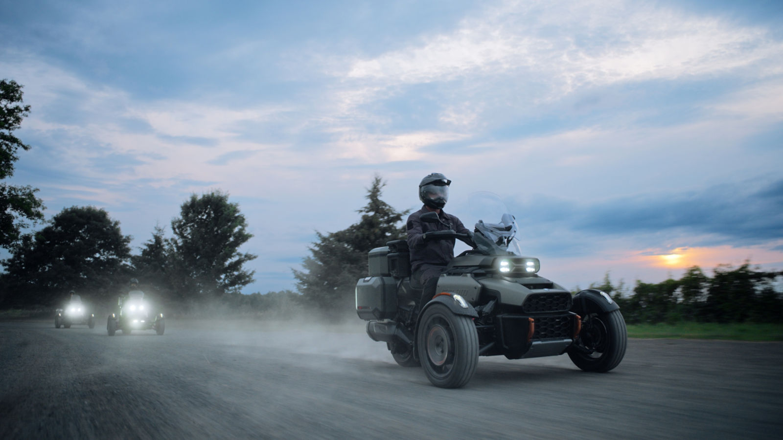 The 3 new Can-Am Canyon 3-wheel vehicles on a gravel road