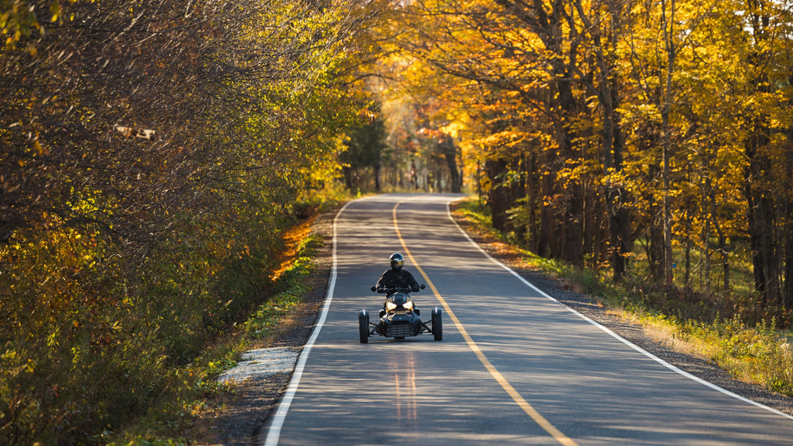 Can-AM 3-wheeled vehicle on a road