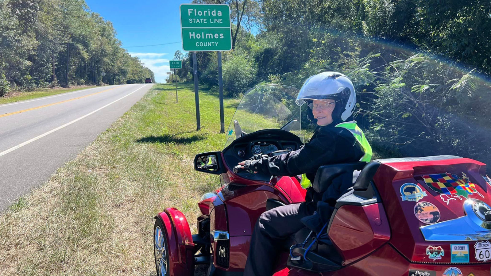 A woman on her 3-wheel Can-Am motorcycle ready to go to Florida