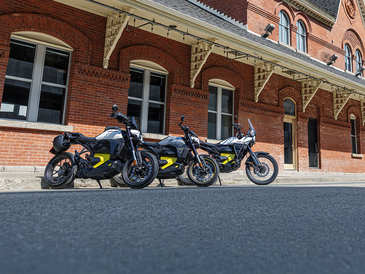 Several Can-Am electric motorcycles parked next to each other
