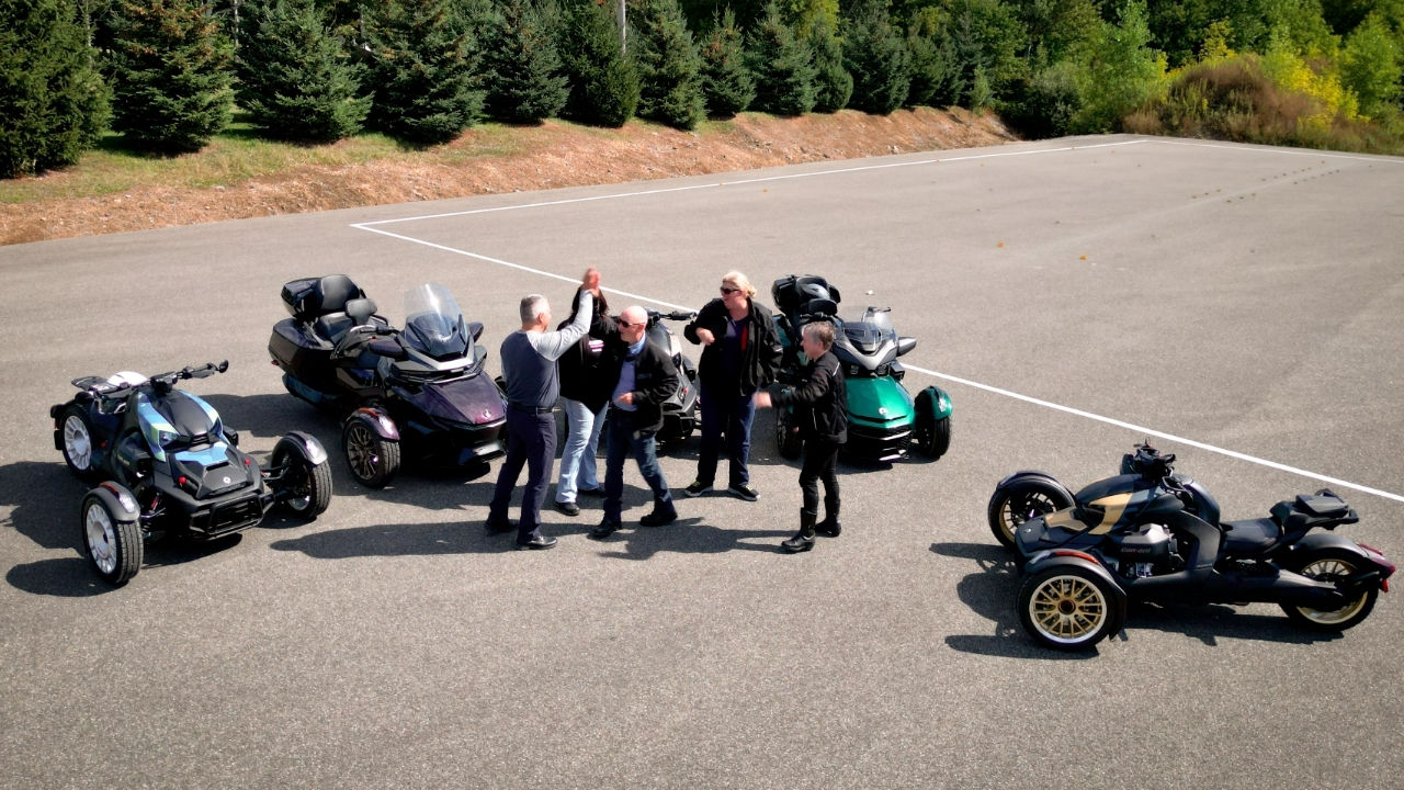Several people taking their Can-Am 3-wheel motorcycle driving test