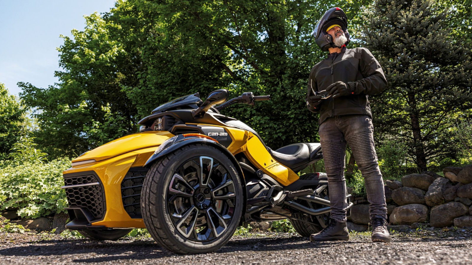A rider on his 2026 Can-Am Spyder F3 on a paved road