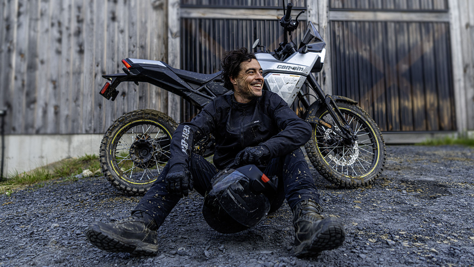 Rider putting in new oil in this Can-Am 3-wheel vehicle