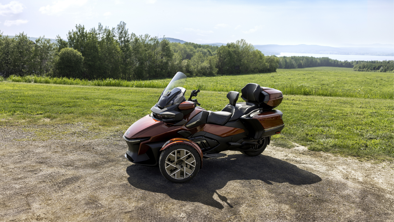 A rider using the storage space on the new 2026 Can-Am Spyder F3-S