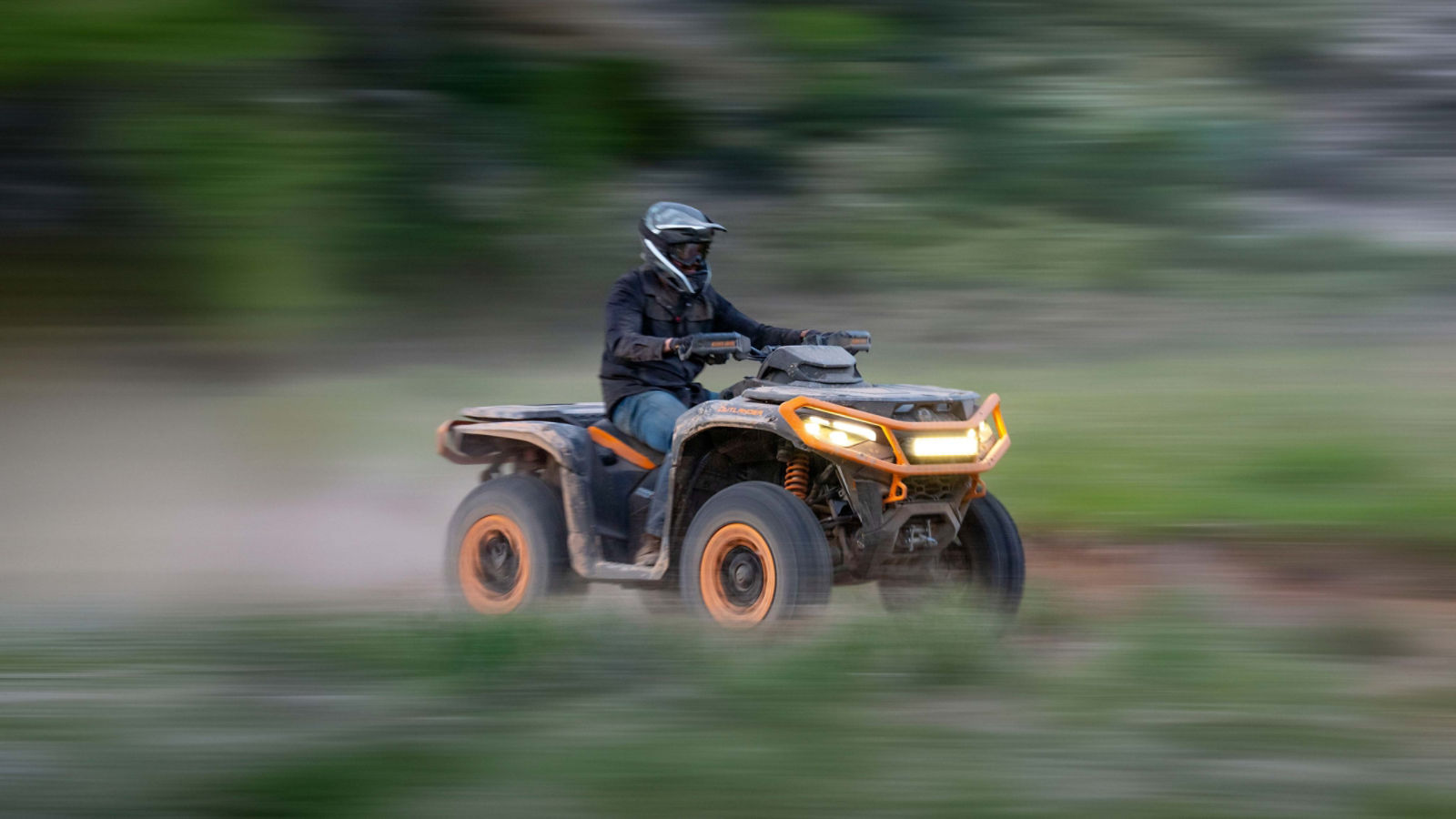 A group of friends taking a break near their Can-Am ATV & Side-by-Side
