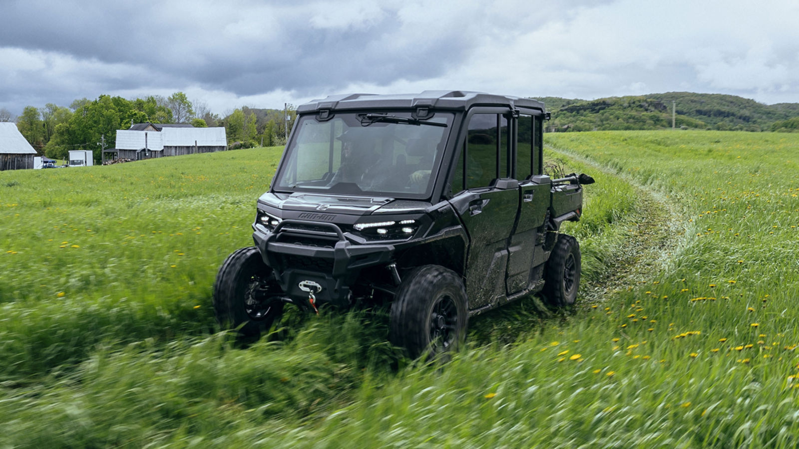 Three farmers in a 4-seater Can-Am Defender Max Limited 