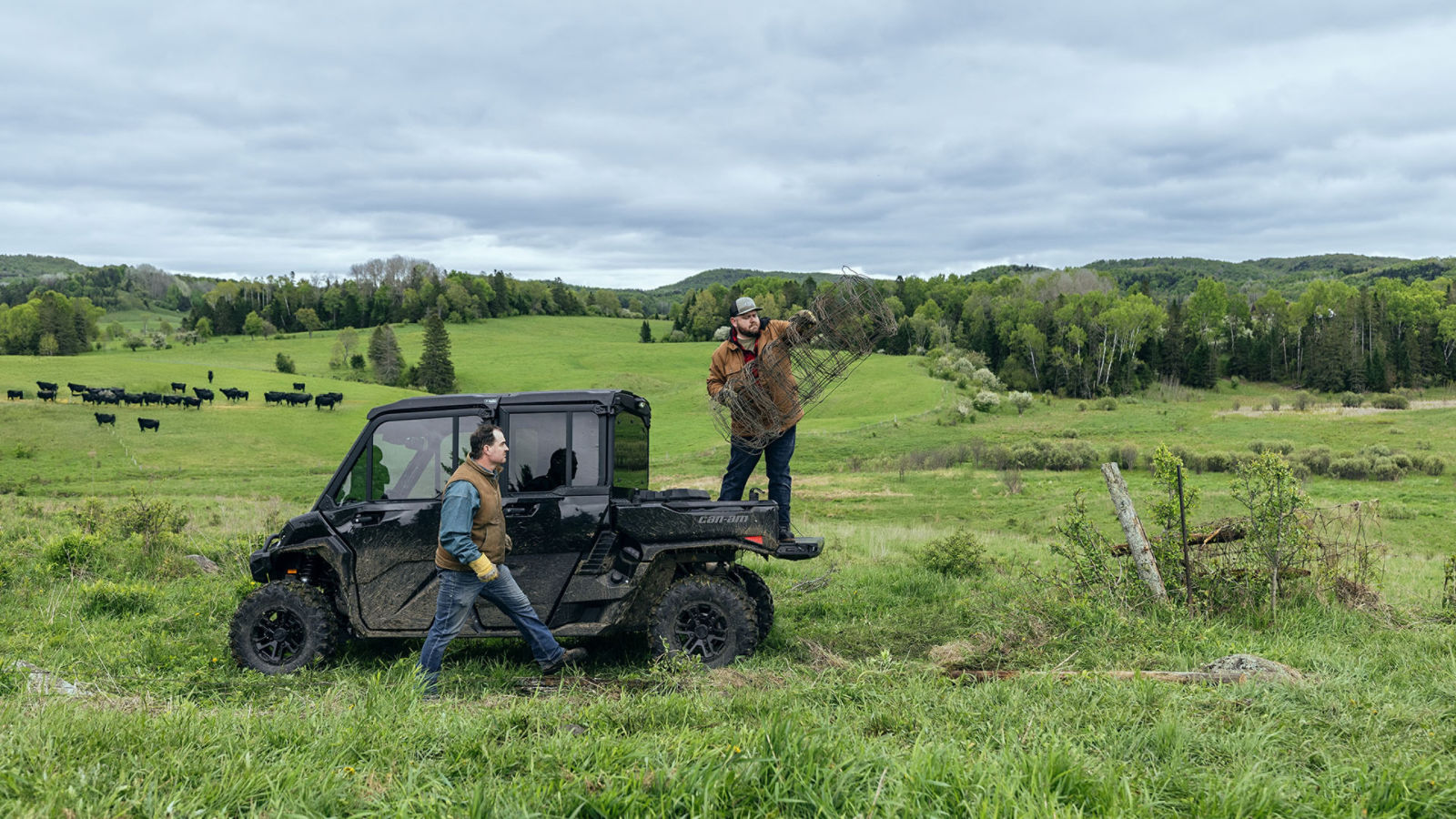Two workers near their 2026 Can-Am Defender HD11 MAX LoneStar