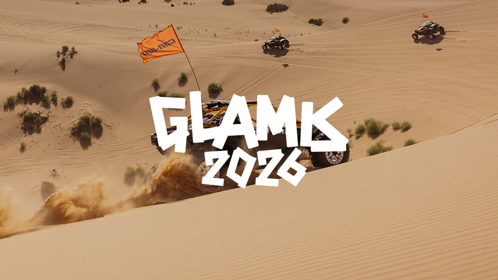 Can-Am Maverick side-by-side vehicles driving up sand dunes with text reading GLAMIS 2026