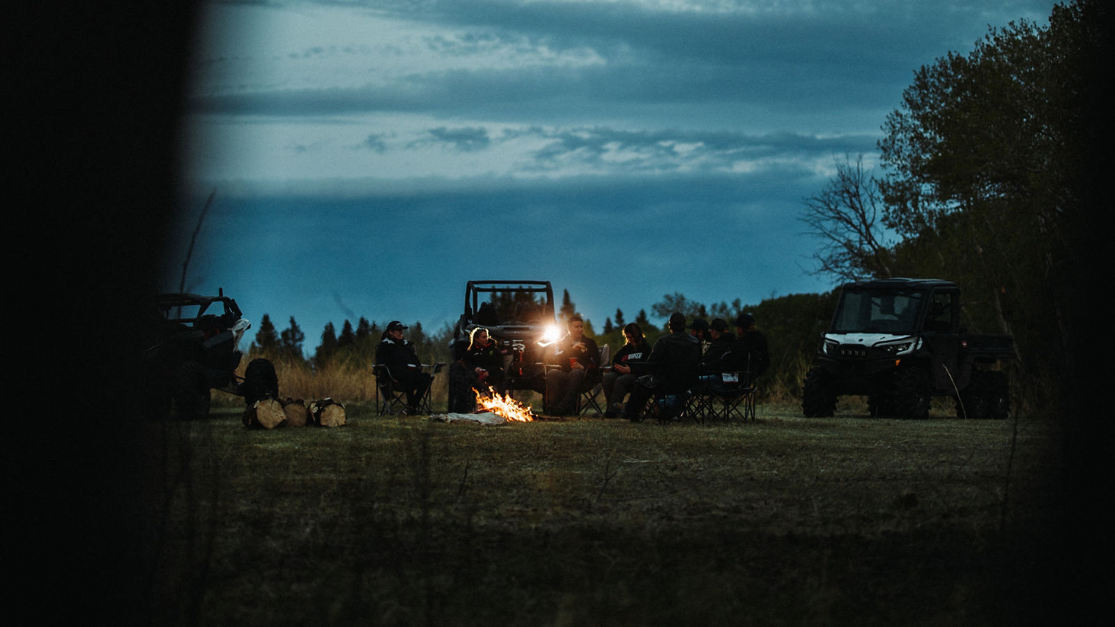 People around campfire in the distance