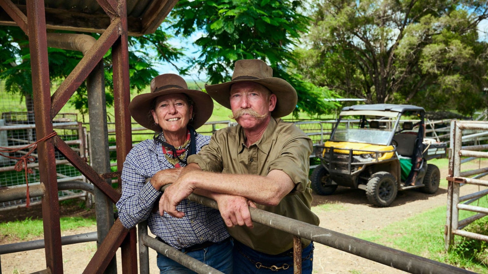 Cate and Dick Buckham standing with their Can-Am Defender