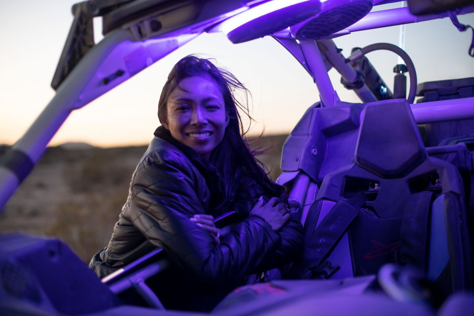 Woman at dusk by her Can-Am Maverick
