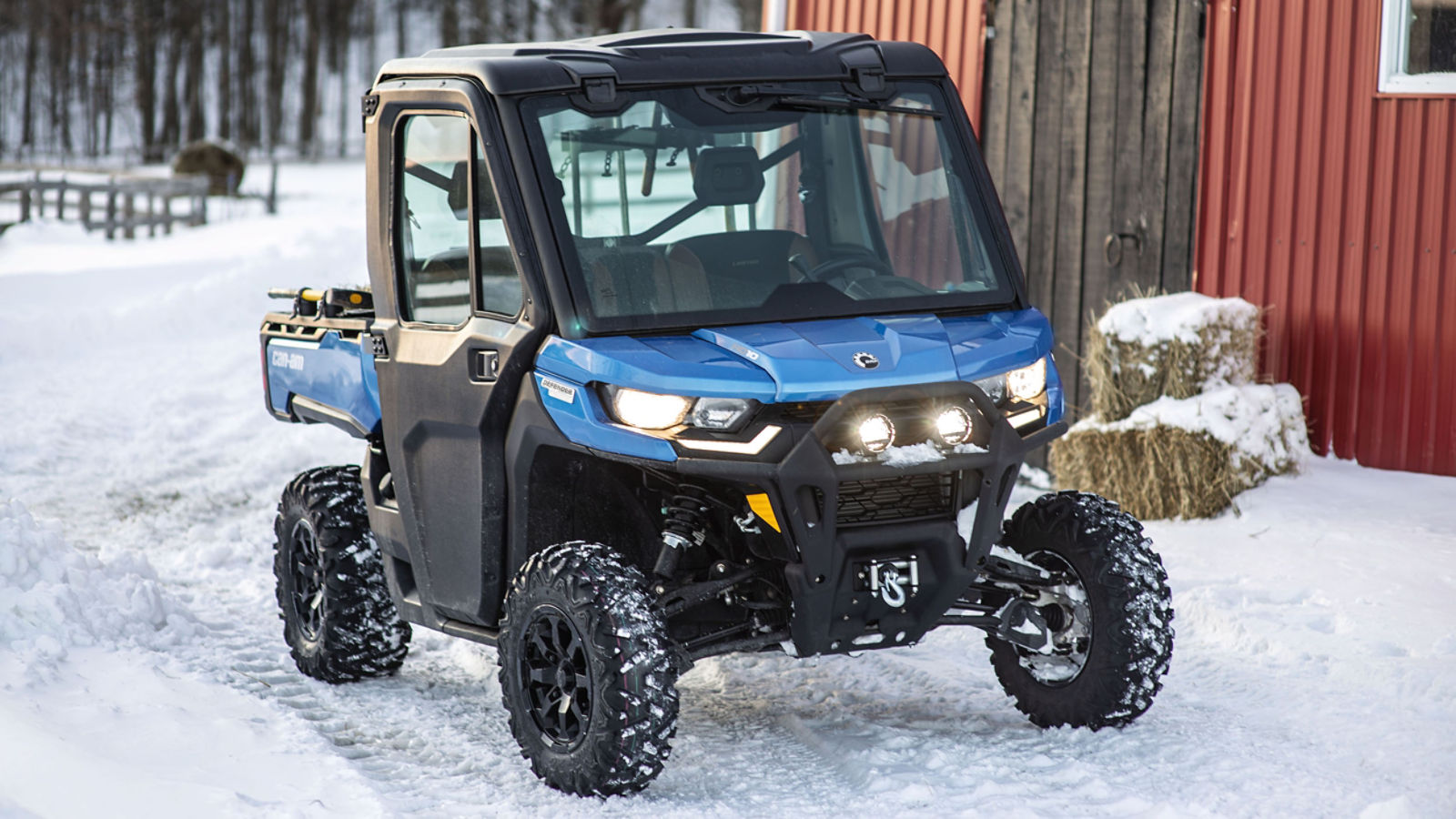 A Can-Am Defender beside a building