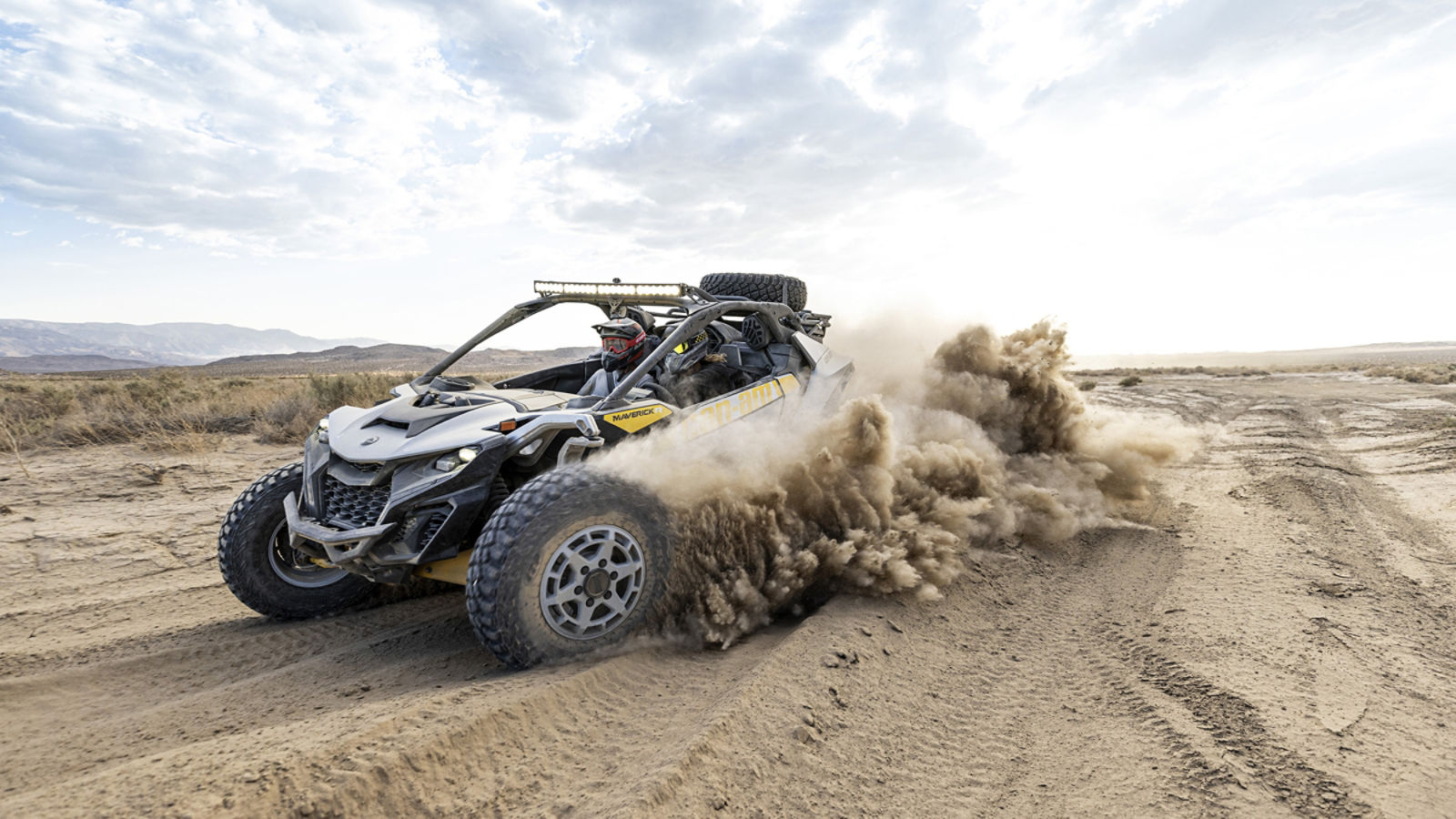 A Can-Am Maverick R crusing in the desert