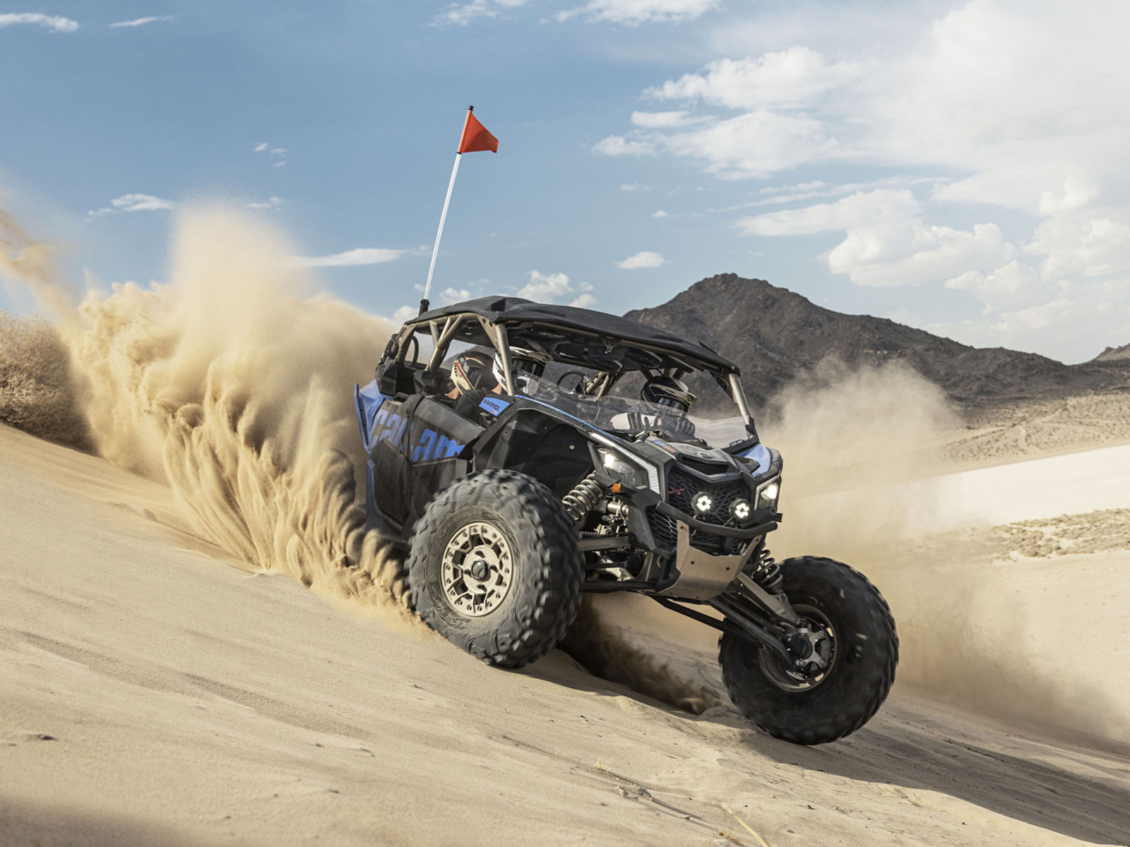A Can-Am Maverick X3 Max XRS side-by-side having fun in the sand 