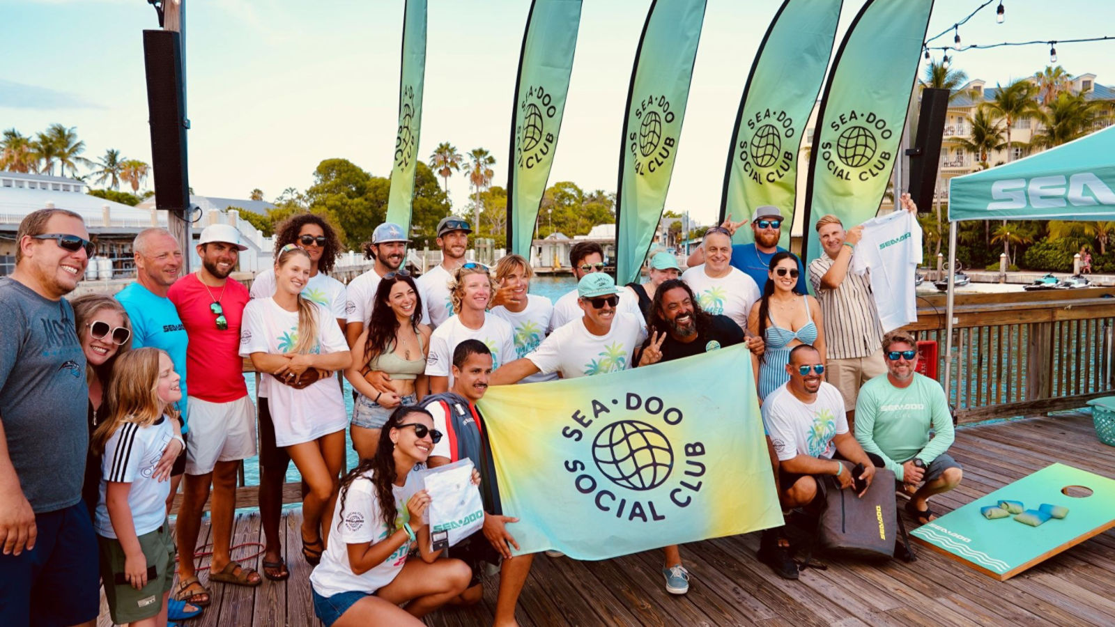 A group of riders posing for a picture at a Sea-Doo Social Club event in Key Largo, Florida