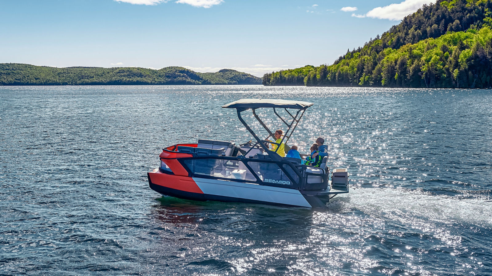 Family riding on their Sea-Doo SWITCH pontoon boat