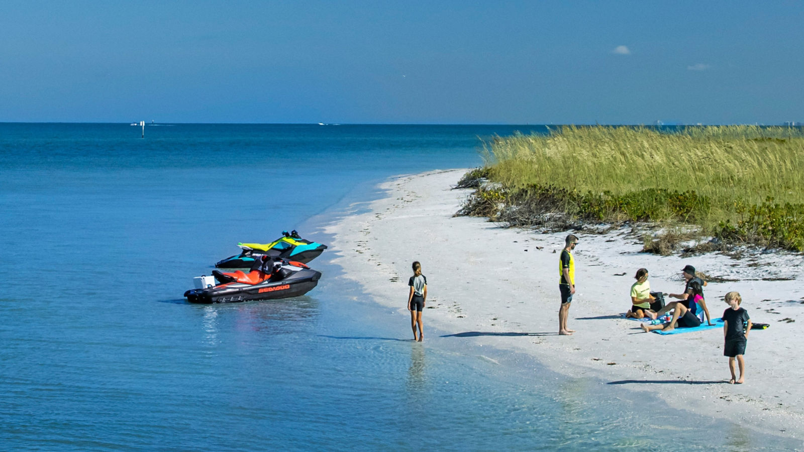 Family enjoying the Sea-Doo Life on a beach