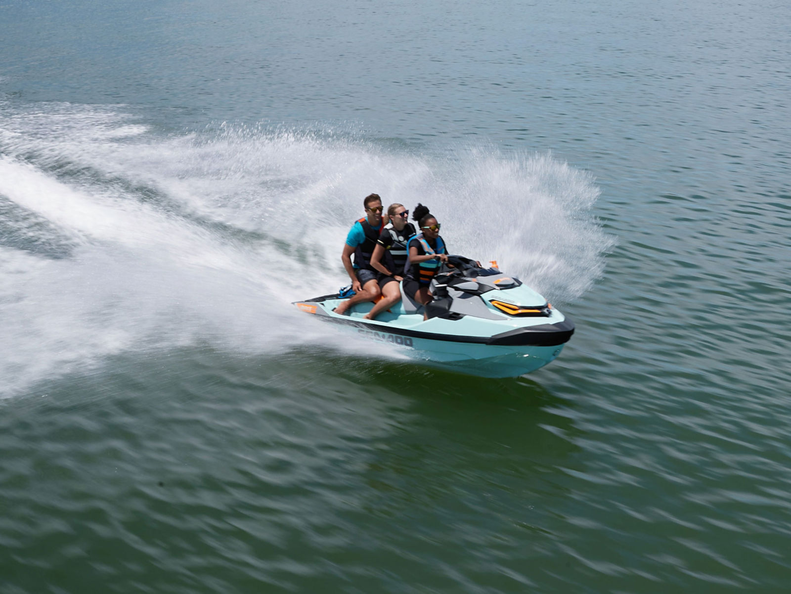 Group of friends riding a Sea-Doo WAKE PRO