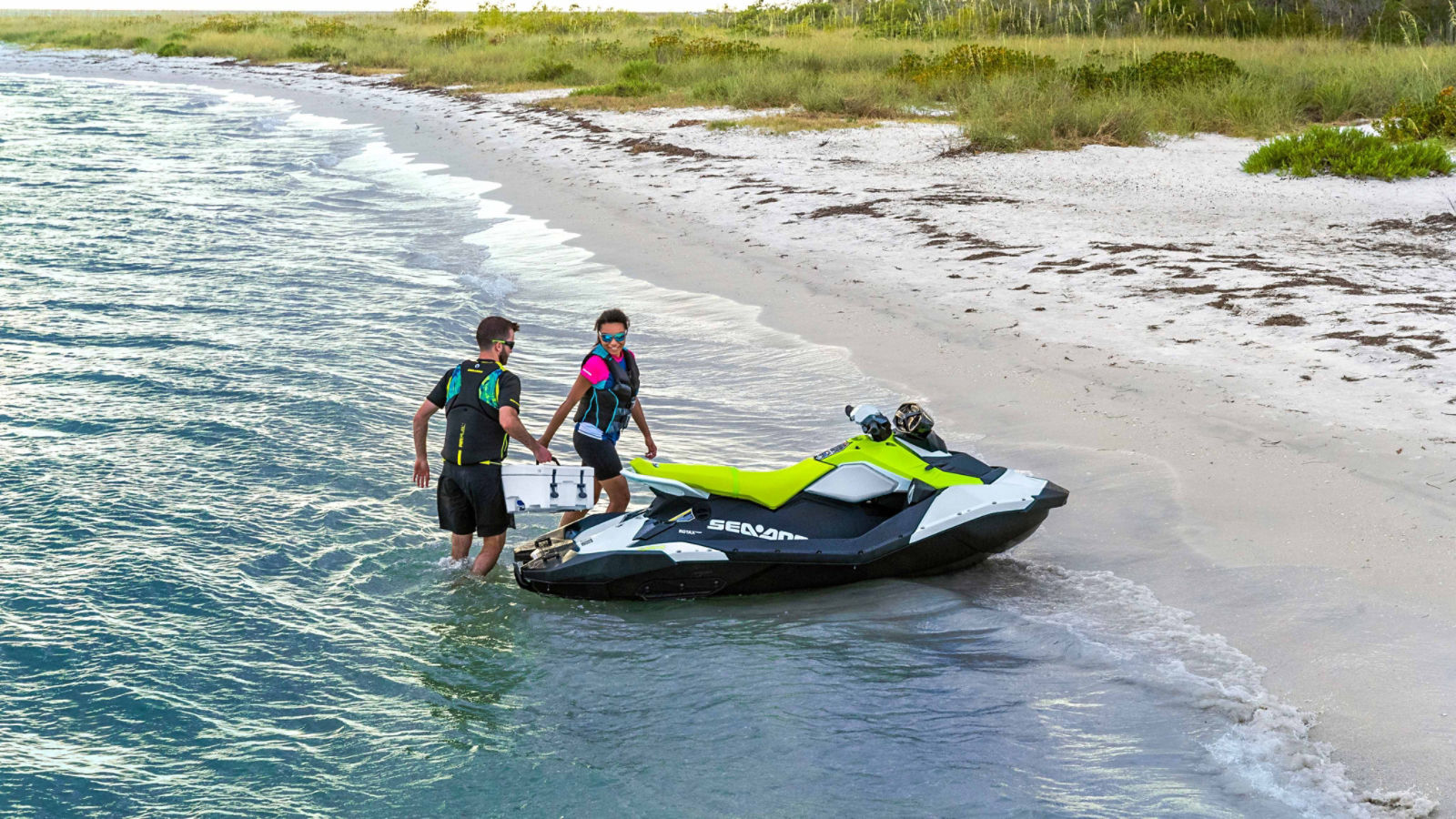Couple arriving on the beach with their Sea-Doo