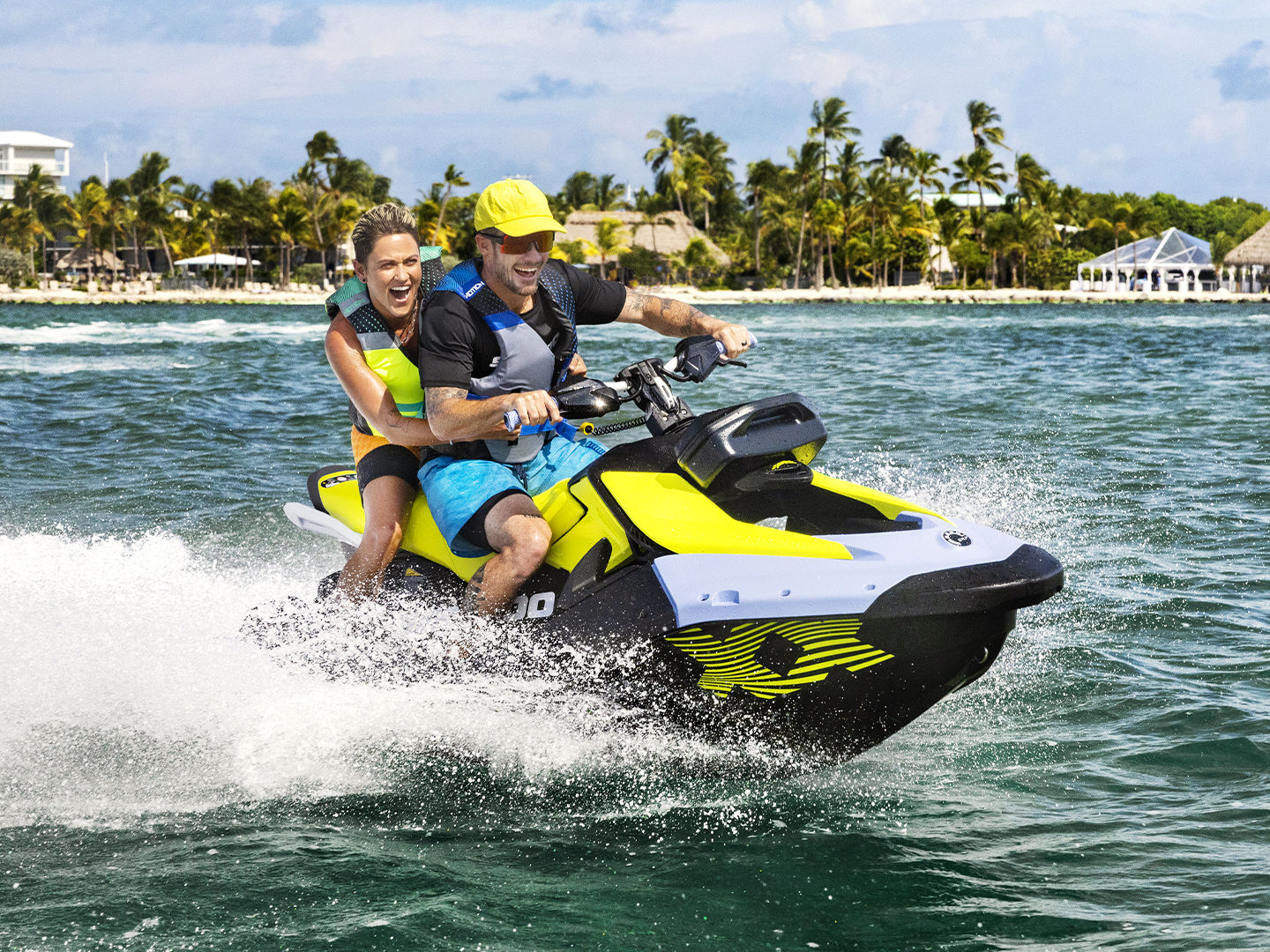 Couple riding a Sea-Doo Spark Trixx personal watercraft
