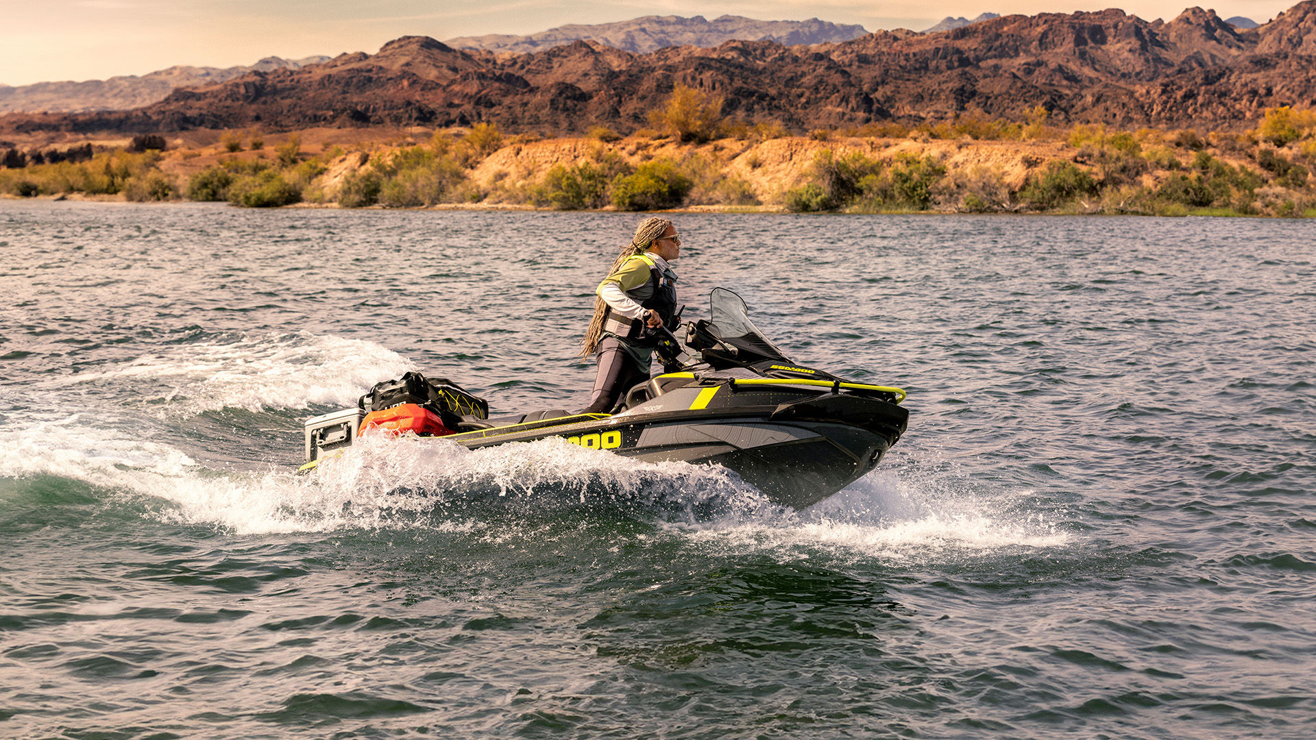  Rider zooming across the lake on her Sea-Doo PWC